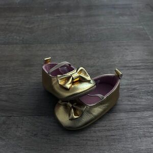 Gold baby ballet shoes